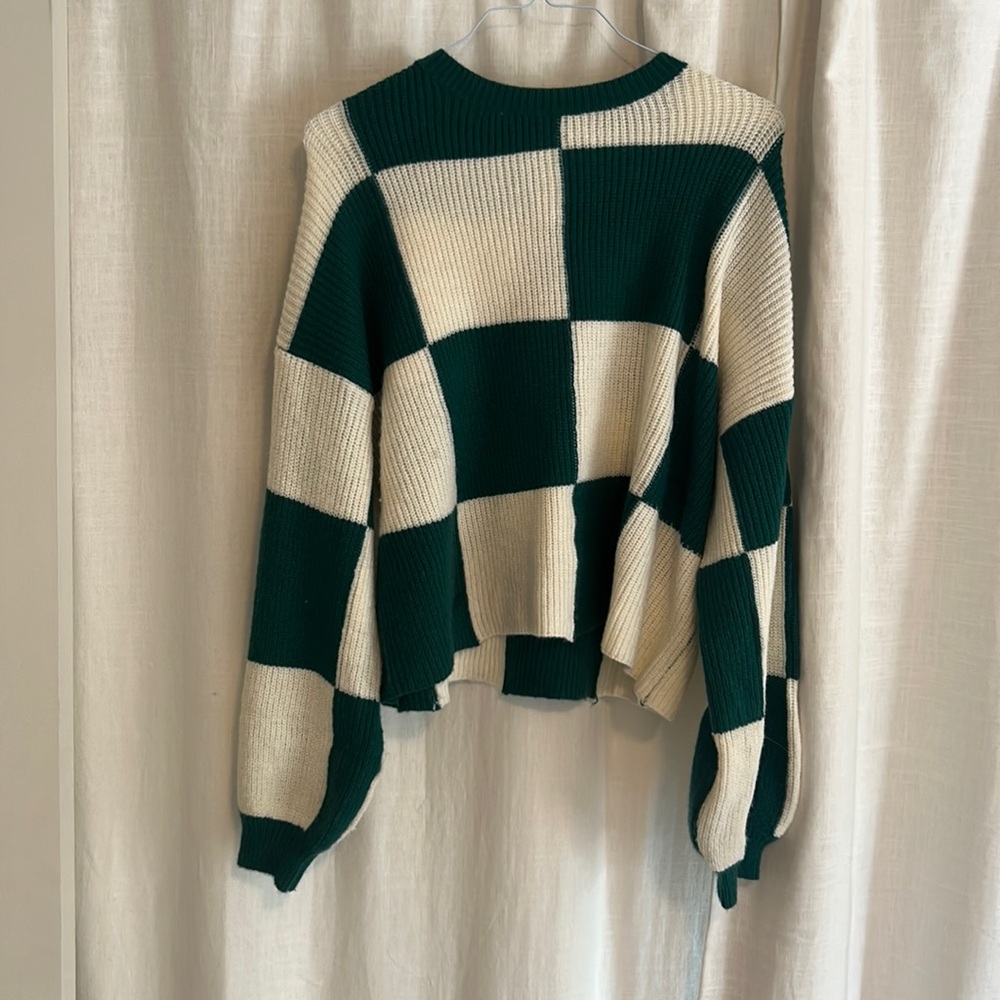 Green and cream checkered pattern sweater